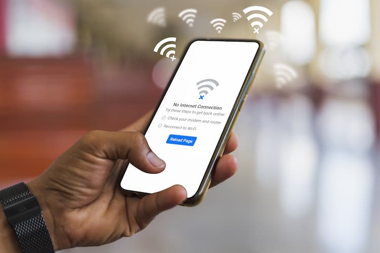 Man holding smartphone but can't connect wifi.